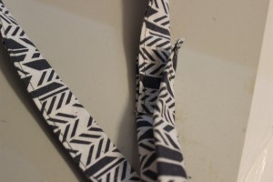 Overlapped the two end pieces, matching the same stitched sides together.