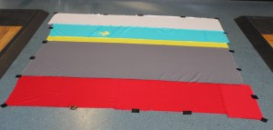 The back of the quilt, attached to the floor with duct tape.