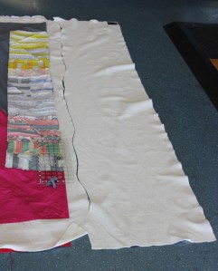 I pulled the top and back away from the batting and cut the batting in a wavy line.