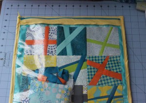 I'm using a charm pack called Sphere. There is one completed block in the pouch.